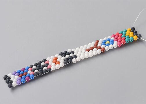 Side view of five columns of seed beads, stitched together